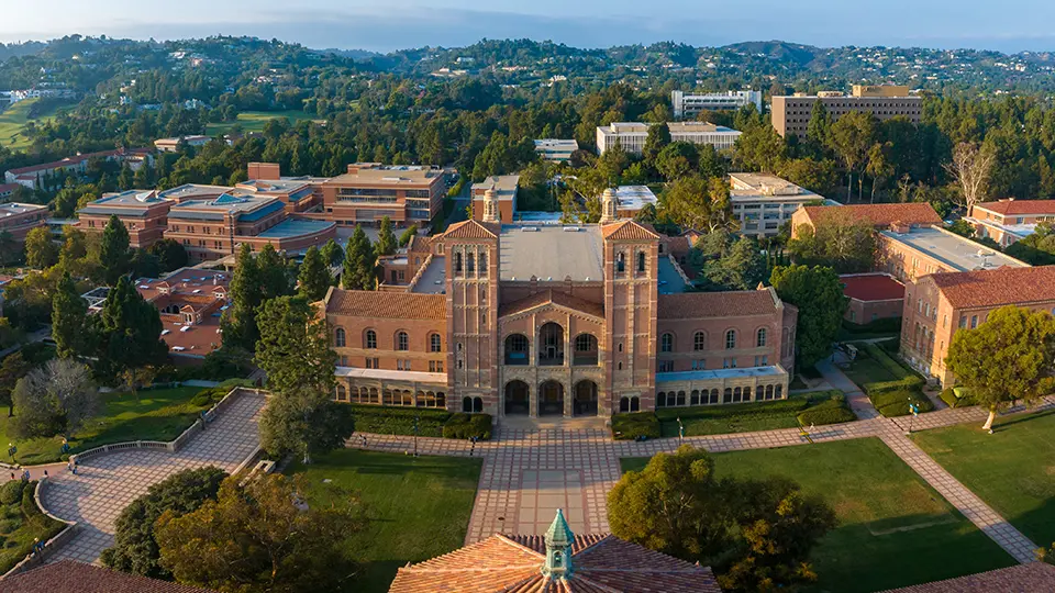 Aerial view of a large university campus with historic buildings and greenery
