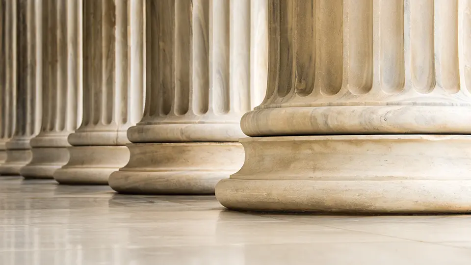 Close-up of stone columns at a historic university campus building